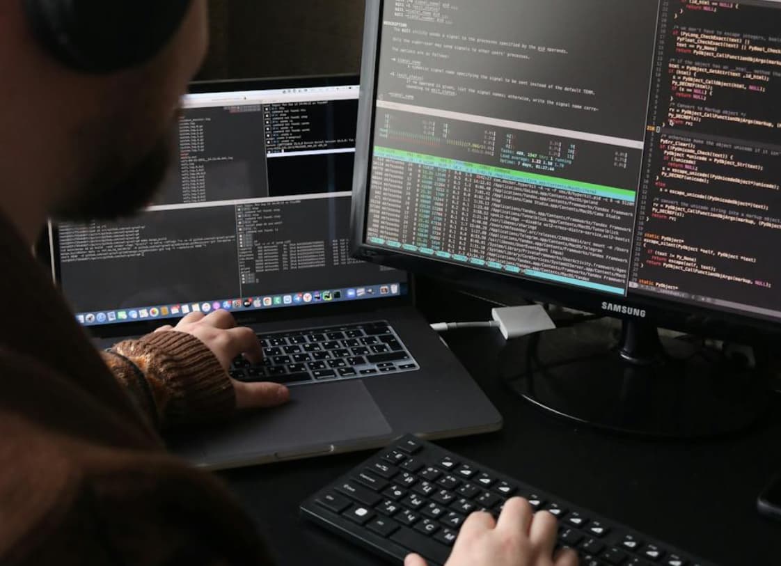 Person working with monitors